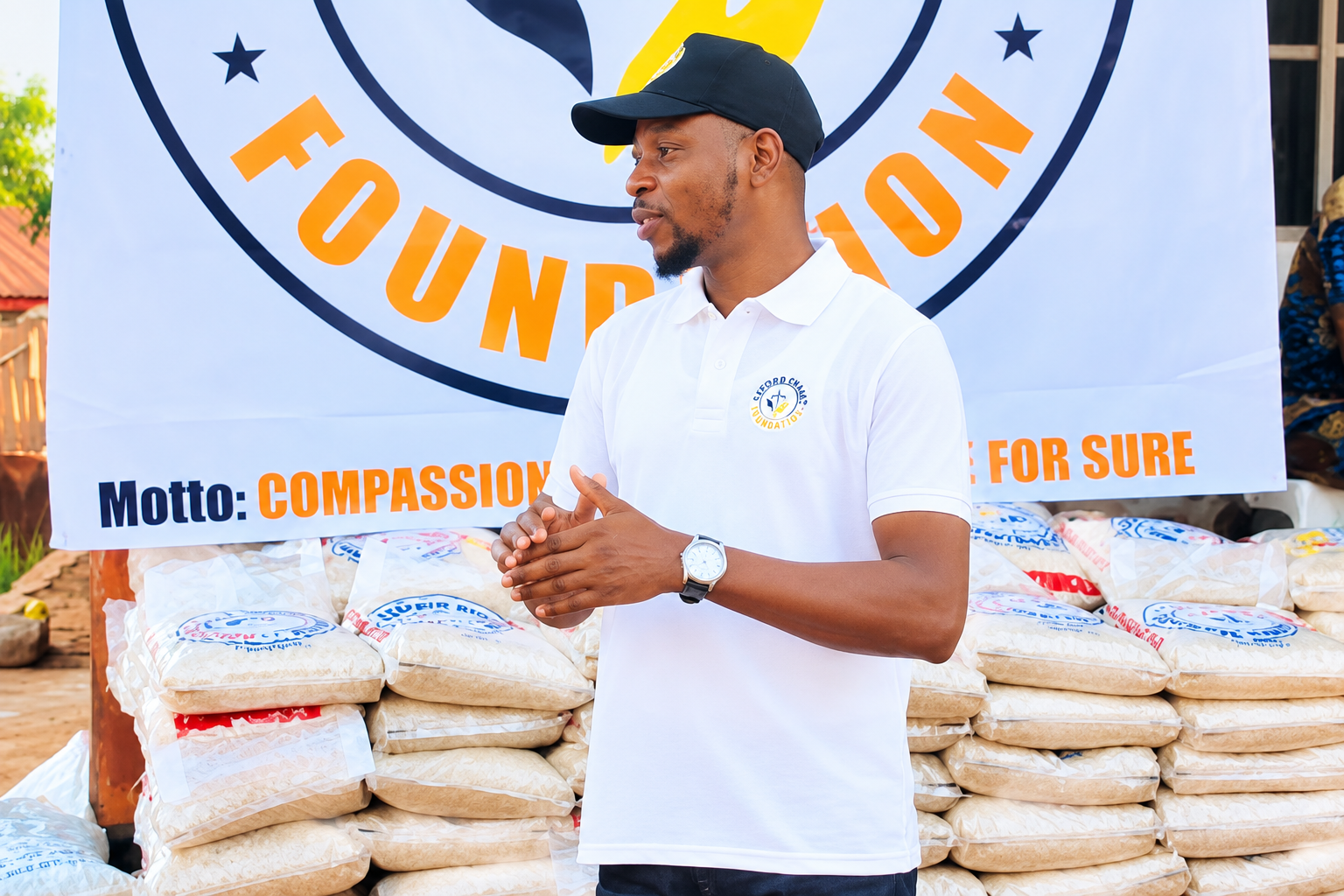 Foundation representative speaking during a food relief distribution activity